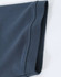 A close-up of a navy blue men's cotton stretch polo shirt, highlighting the fabric and sleeve detail.