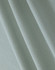 A close-up of light green cotton fabric, featuring a textured weave suitable for polo shirts.