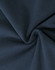 A close-up of navy cotton fabric displaying its soft texture and stretch qualities.