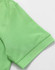 A green polo shirt featuring a pique texture, showcasing the collar and sleeve detail with a logo.