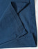 A folded section of a navy blue polo shirt featuring stitching details and a logo.