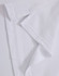 A close-up of a white polo shirt fabric, showcasing the collar and stitching details. Contains a logo.