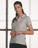 A light grey ladies' polo shirt with a collar and a button placket, featuring a logo on the side.