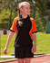 Tri-colour short-sleeve polo shirt in black with orange accents, designed for kids. Features a logo on the chest.
