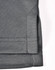 A grey sustainable poly/cotton polo shirt featuring detailed stitching and a side vent design.