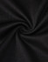 A close-up of black fabric, featuring a smooth texture with a slight stretch, typical of a polo shirt.