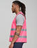 A pink safety vest with grey reflective tapes, worn by a man with long hair, showcasing side view design.