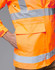 An orange safety jacket with reflective stripes and a pocket, designed for high visibility. Contains a logo.