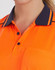 A close-up of an orange polo shirt with navy blue collar detailing and buttons. The shirt features a pocket and has a logo.