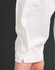 A close-up of a white sleeve of a garment, highlighting the stitching and fabric texture.