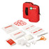 A red first aid kit with two zipped pouches and various first aid supplies including bandages, scissors, and sterile dressings.
