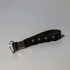 A black key chain stress reliever with popper buttons and a silver attachment ring.