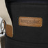 A drink bottle cooler bag in dark fabric with a tan leather tag and a sturdy strap. Features a logo.