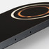 A dual wireless charger in black with a circular design and a metallic accent, featuring a logo.