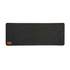 A dark gray desk mat with a felt texture and a small leather label in one corner.