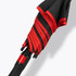 A black and red umbrella with a folded canopy and a black handle featuring a branding logo.