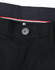 A close-up of black chino pants featuring a button and detailed waistband with a contrasting stripe.