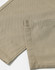 A close-up of khaki chino pants, highlighting the fabric and stitched hem. The image features a logo or branding detail.