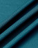 A close-up of a textured, sustainable jacquard knit fabric in a rich teal colour.