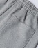 A close-up of grey unisex sweatpants featuring an elastic waistband and a back pocket.