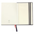 An open diary featuring smooth cream pages with a black cover and a ribbon bookmark in red and blue.