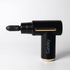 A black massage gun with a gold accent and a detachable applicator head. It features branding on the side.