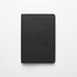 A black notebook featuring a logo on the front cover, with a smooth, matte finish.