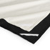 A tea towel featuring a black bottom edge and cream top, with decorative white stitching along the seams.