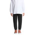 Black track pants for kids, featuring an elastic waistband and cuffs, paired with a white long-sleeve top and casual shoes.