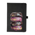 A black journal featuring a design of three stacked donuts with chocolate and pink icing.