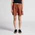A pair of rust-coloured linen shorts with an elastic waistband and drawstring, featuring two side pockets.