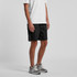 Black sports shorts featuring side pockets and a branded logo. Suitable for casual wear or sporting activities.