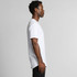 A white Staple Curve Tee displayed on a model, showcasing its side profile and relaxed fit.