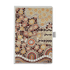 A bound journal featuring an intricate Aboriginal-inspired design in earthy tones, with a clasp closure and branding.