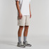 Relax Track Shorts in light beige, styled with a white shirt and grey sneakers. The shorts feature a logo.