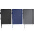 Three notebooks in black, blue, and grey with elastic closures and pens attached. Each has a textured finish.