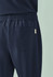 Navy unisex straight leg scrub pant with an elastic waistband and a back pocket. Includes a logo.