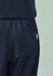 Navy women's jogger scrub pant featuring an elastic waistband and a single back pocket. Includes branding detail.