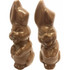 A brown chocolate Easter bunny figurine with exaggerated features, presented in pairs.