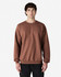 A brown Gildan Softstyle adult sweatshirt displayed on a model, featuring a classic crew neck and long sleeves.