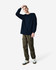 A model wearing a navy heavyweight cotton unisex long sleeve T-shirt paired with olive cargo pants and sneakers.