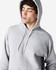 A grey Gildan Softstyle adult hooded sweatshirt featuring a drawstring hood and a simple design without visible branding.