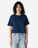A navy women's fine jersey boxy T-shirt featured on a model, paired with light blue jeans. The shirt has a logo.