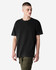 A black unisex garment dyed heavyweight cotton t-shirt displayed on a model, featuring a relaxed fit.