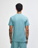 A green mockneck unisex T-shirt featuring a back view of the garment. It has a logo.