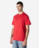 A red Gildan Light Cotton T-Shirt displayed on a model, featuring a crew neckline and short sleeves.