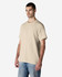 A light beige Gildan Light Cotton T-Shirt displayed on a model, featuring a simple design and a logo.