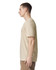 A unisex V-neck T-shirt in a beige colour, displayed on a model from the side. The shirt has a logo.