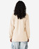 A long sleeve T-shirt in beige, viewed from the back, featuring a logo on the upper back.