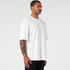 An oversized white t-shirt featured on a model, showcasing a relaxed fit and short sleeves.